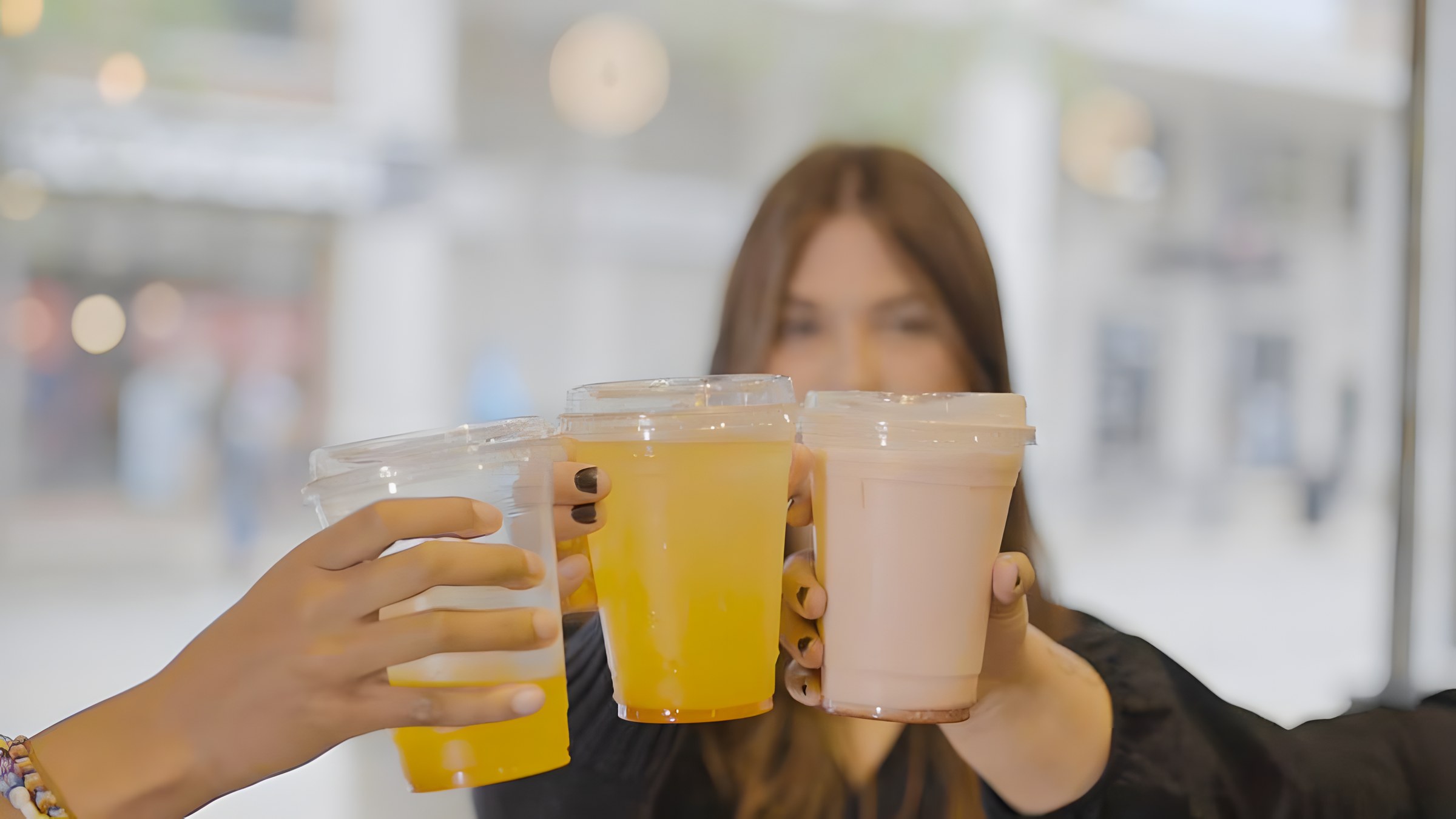 Guests holding drinks at an event